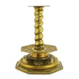 A Scandinavian brass repoussé candlestick,