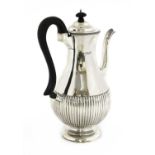 A silver coffee pot,