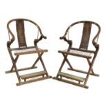 A pair of Chinese padoukwood yoke back folding chairs,