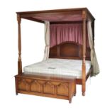 A reproduction mahogany king sized four-poster bed,