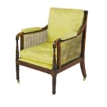 A mahogany bergère library armchair,