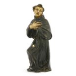 An early Spanish carved wood religious figure of a monk,