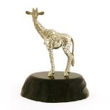 A contemporary silver sculpture of a giraffe