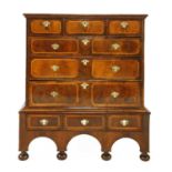 A William and Mary yew, walnut and satinwood inlaid chest on stand,