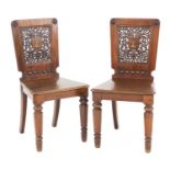 A pair of mahogany hall chairs,