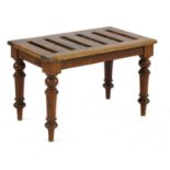 A walnut luggage stand,