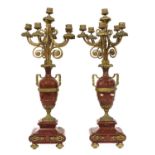A pair of Louis XV-style ormolu and rouge marble six-light candelabra,