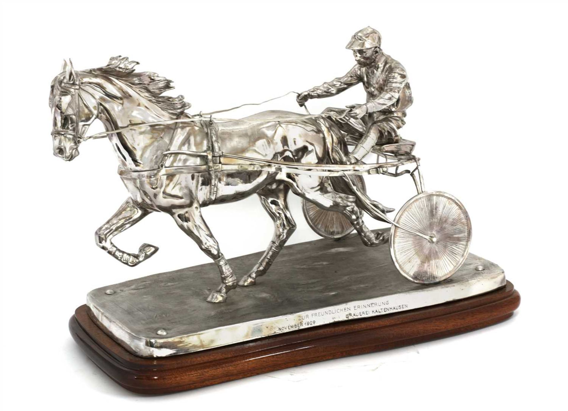 A well modelled silver-plated harness racing trophy,