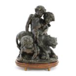 A bronze group of putti playing with a leopard,