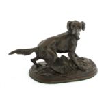 A bronze model of a setter barking,