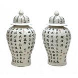 A pair of large Chinese porcelain vases and covers,