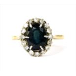 A gold sapphire and diamond cluster ring,