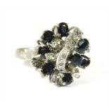 A white metal sapphire cluster ring,