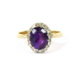 A gold amethyst and diamond cluster ring,