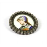 A silver diamond and painted porcelain brooch/pendant,