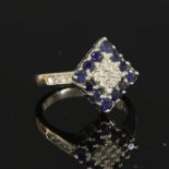 A white gold diamond and sapphire lozenge-shaped cluster ring,