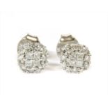 A pair of white gold diamond cluster stud earrings,