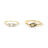 A gold three stone diamond ring,