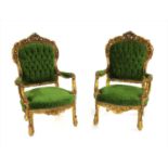 A pair of carved gilt painted armchairs,
