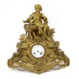 A gilt metal mantel clock,