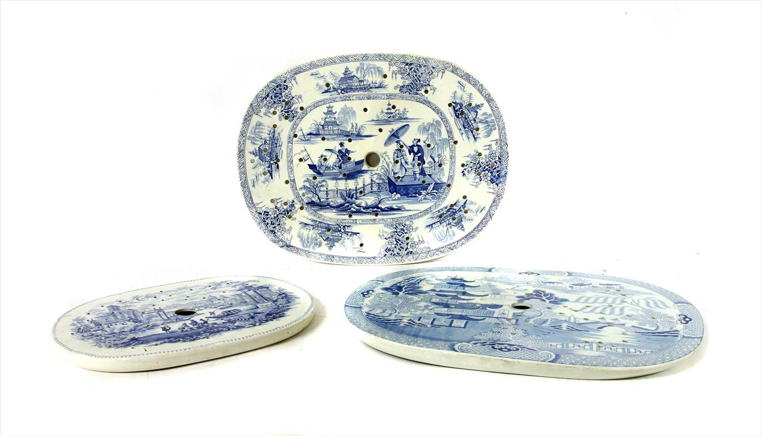 Three 19th century pottery drainers,