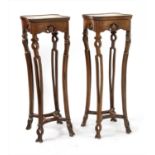 A pair of early 20th century Chinese rosewood urn stands,