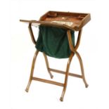 An Edwardian mahogany and crossbanded folding campaign work table