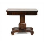 A 19th century rosewood fold over card table on scroll feet,