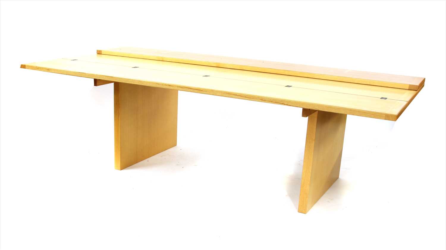 An extending dining boardroom table