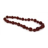 A single row cherry coloured spherical Bakelite bead necklace,