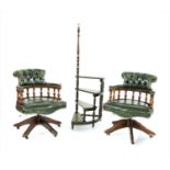 A pair of 20th century studded leather upholstered captain's swivel desk chairs,