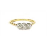 A gold diamond three stone ring,