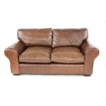 A Laura Ashley 'Bradford' brown vintage leather two seater sofa,