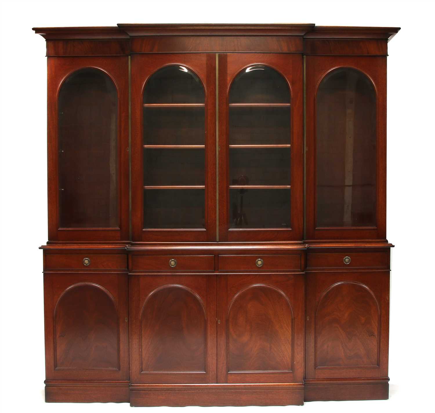 A reproduction mahogany breakfront bookcase,