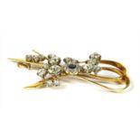 A gold sapphire and diamond spray brooch,