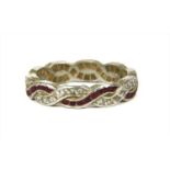 A platinum ruby and diamond full eternity ring,