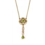 An Edwardian gold peridot and split pearl pendant,