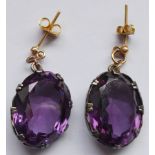 A pair of large hand-cut oval amethyst earrings CONDITION REPORT: Amethyst is