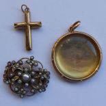 A yellow metal group to include a circular locket with glass,