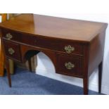 A George III period bow-fronted mahogany and boxwood-strung sideboard of small proportions;