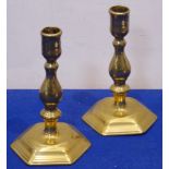 A pair of early 18th century brass candlesticks, each on hexagonal base, 16.