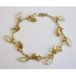 A fine quality gold and opal bracelet