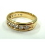 A 14-carat gold half-eternity ring set with 13 fine diamonds