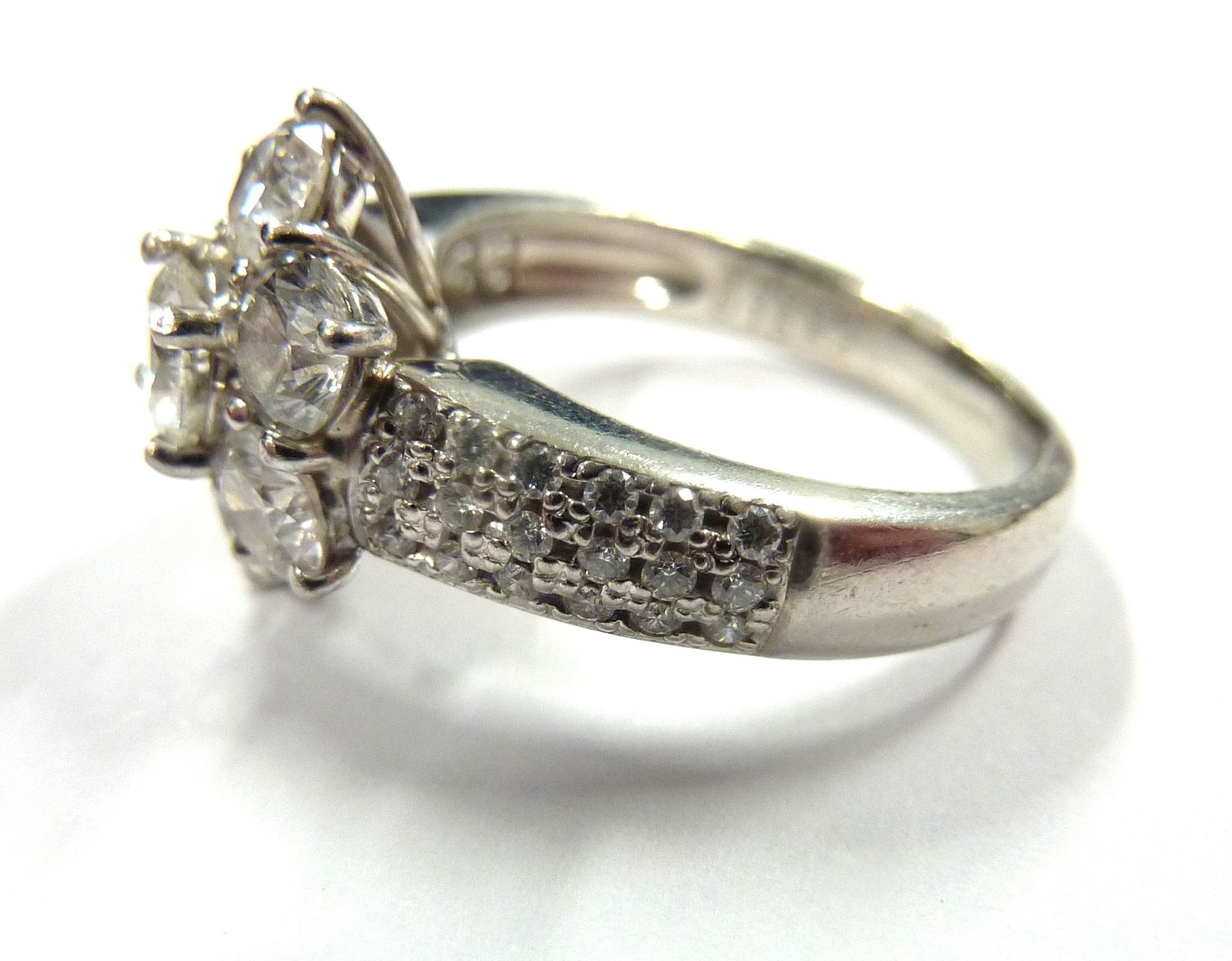 A superb platinum and diamond daisy cluster ring CONDITION REPORT: Although we are - Image 7 of 7