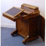 A 19th century walnut Davenport of fine quality;