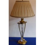 A heavy brass and crystal table lamp with pleated shade,