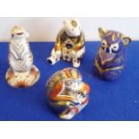 Four Royal Crown Derby paperweights: a meerkat, a seated bear,