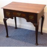 An 18th century oak and mahogany crossbanded low boy;