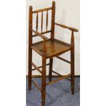 An unusual early-19th century child's ash and elm seated high chair of good colour; spindle-back,