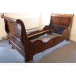 A good early 19th century Dutch walnut and marquetry sleigh bed decorated with birds, butterflies,